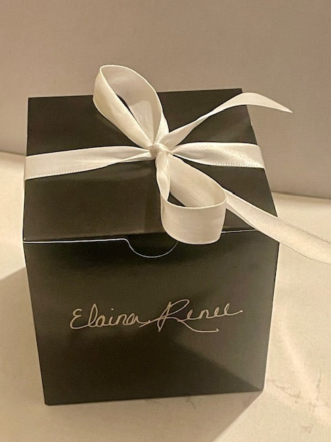Black candle box with white ribbon bow